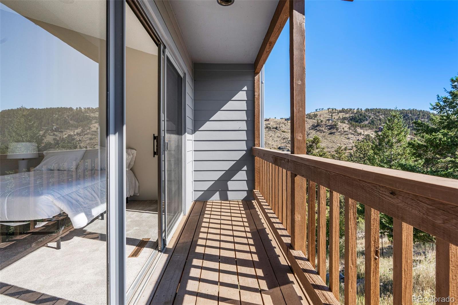 319 Camino Bosque Boulder, CO 80302 - Photo 29 of 44 a view of balcony with wooden floor and fence
