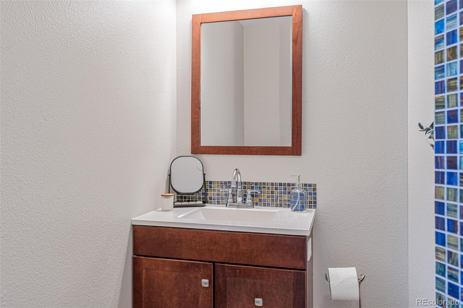 319 Camino Bosque Boulder, CO 80302 - Photo 32 of 44 a bathroom with a sink and a mirror
