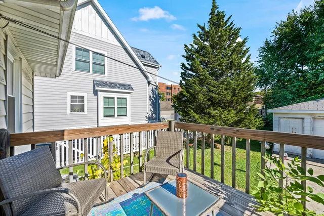 a view of a two chairs in the balcony