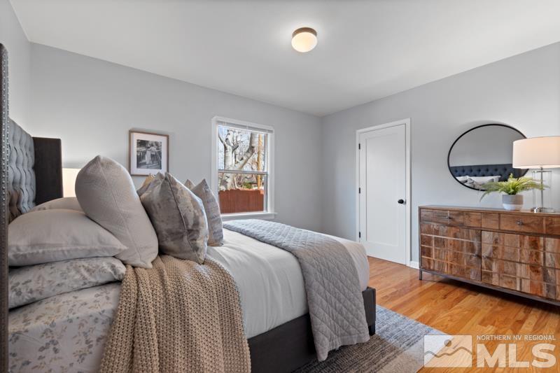 930 Nixon Avenue Reno, NV 89509 - Photo 12 of 27 a bedroom with a bed and a dresser