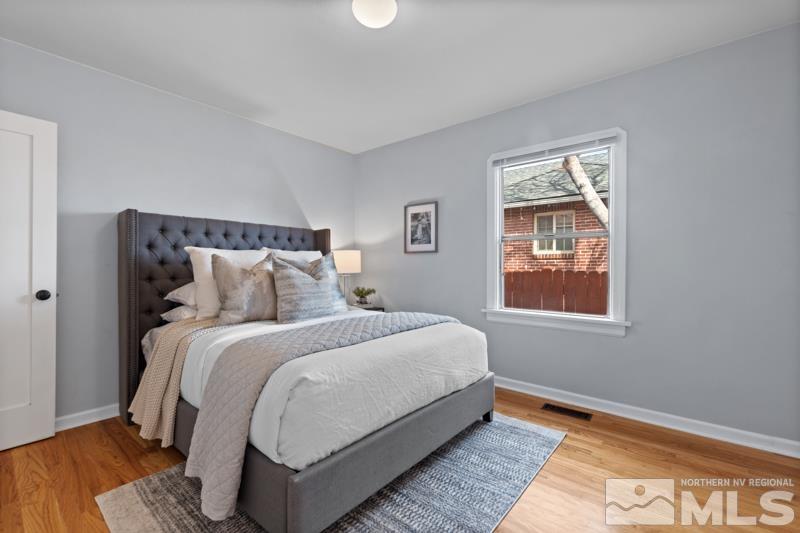 930 Nixon Avenue Reno, NV 89509 - Photo 13 of 27 a bed sitting in a bedroom next to a window