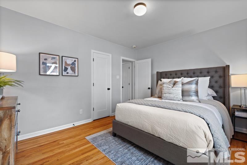 930 Nixon Avenue Reno, NV 89509 - Photo 14 of 27 a bedroom with bed and painting on the wall