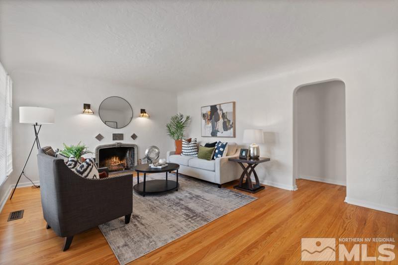 930 Nixon Avenue Reno, NV 89509 - Photo 6 of 27 a living room with furniture fireplace and wooden floor