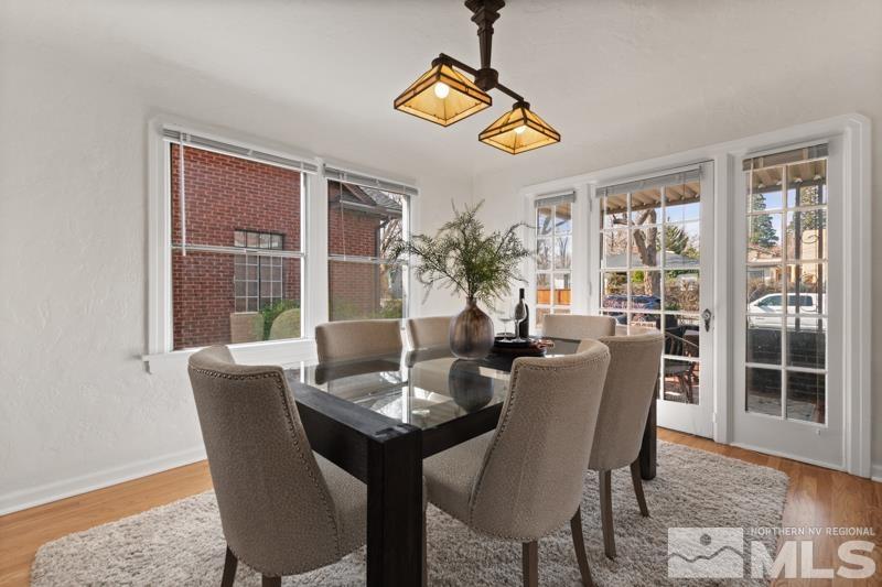 930 Nixon Avenue Reno, NV 89509 - Photo 9 of 27 a dining room with furniture a chandelier and wooden floor