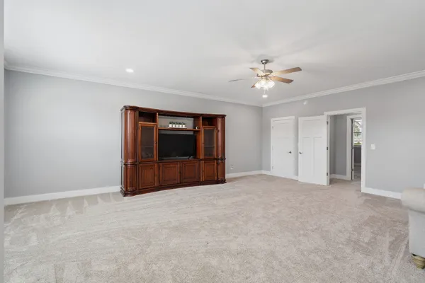 a view of an empty room and closet area