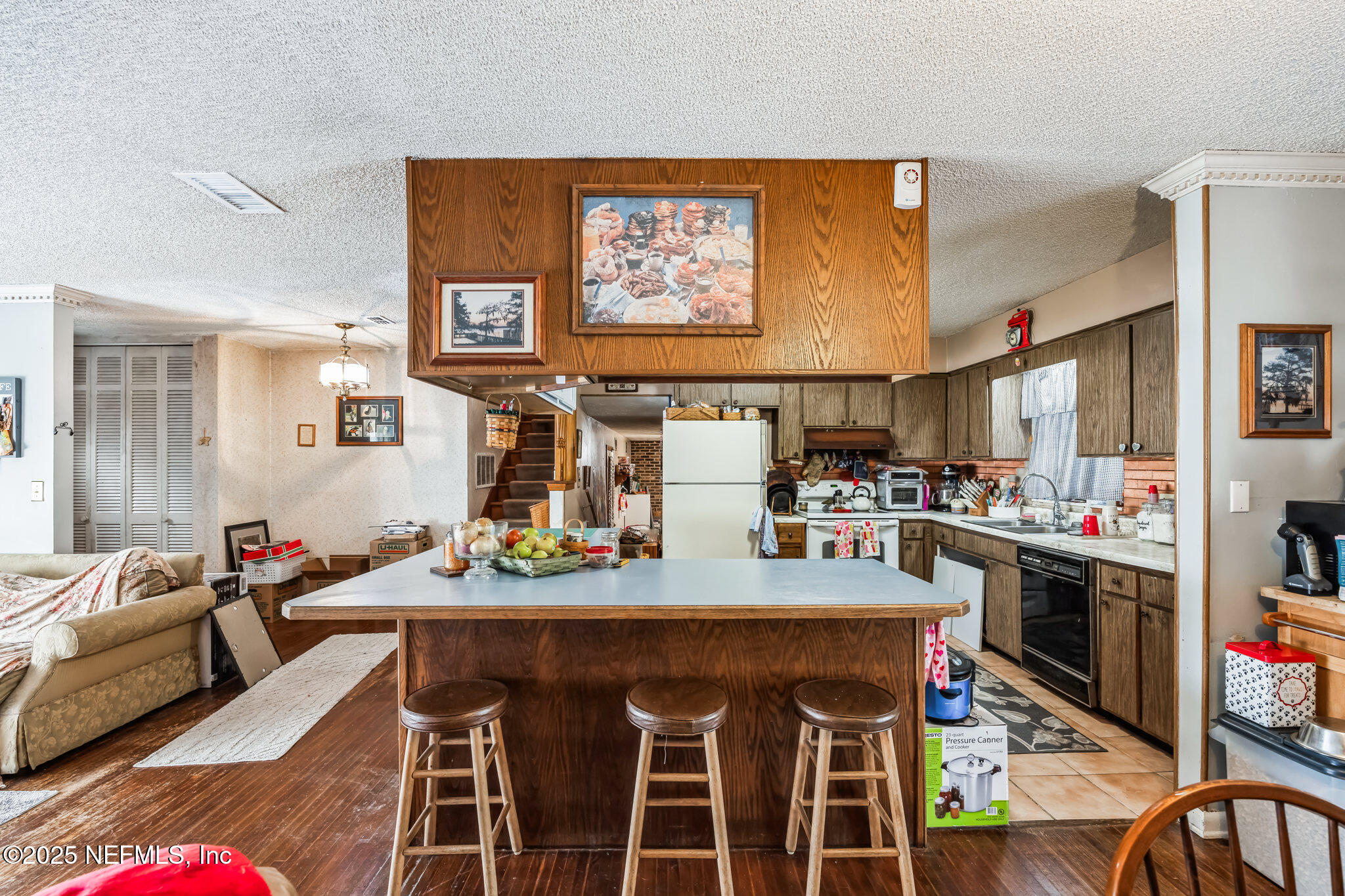 4134 Pine Road Orange Park, FL 32065 - Photo 12 of 30 a view of a dining room with furniture and wooden floor