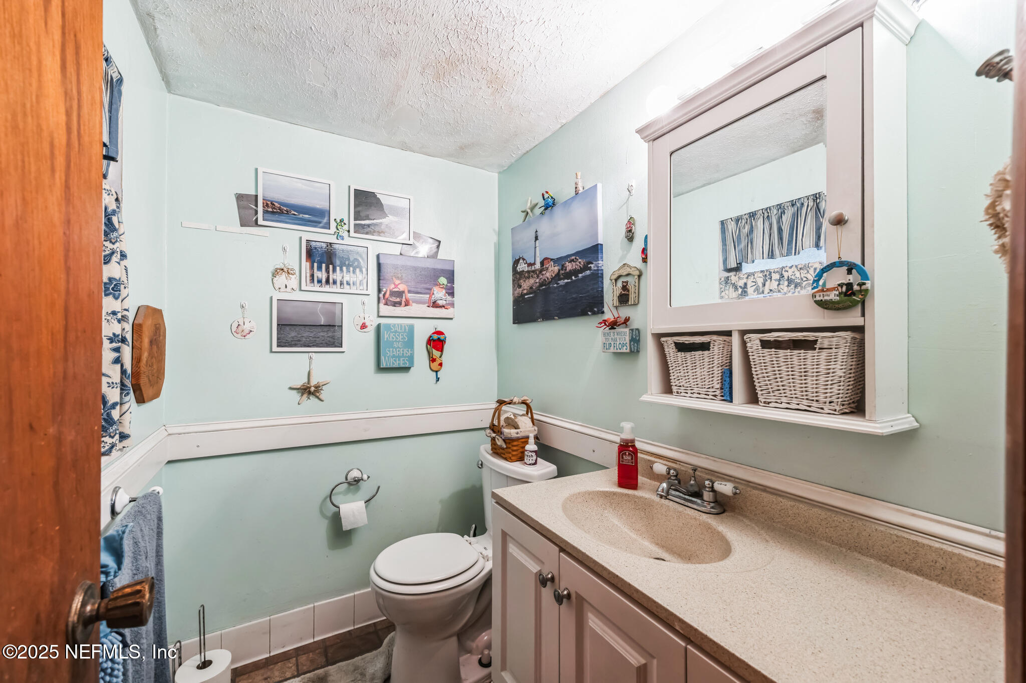 4134 Pine Road Orange Park, FL 32065 - Photo 14 of 30 a bathroom with a granite countertop sink mirror vanity and toilet