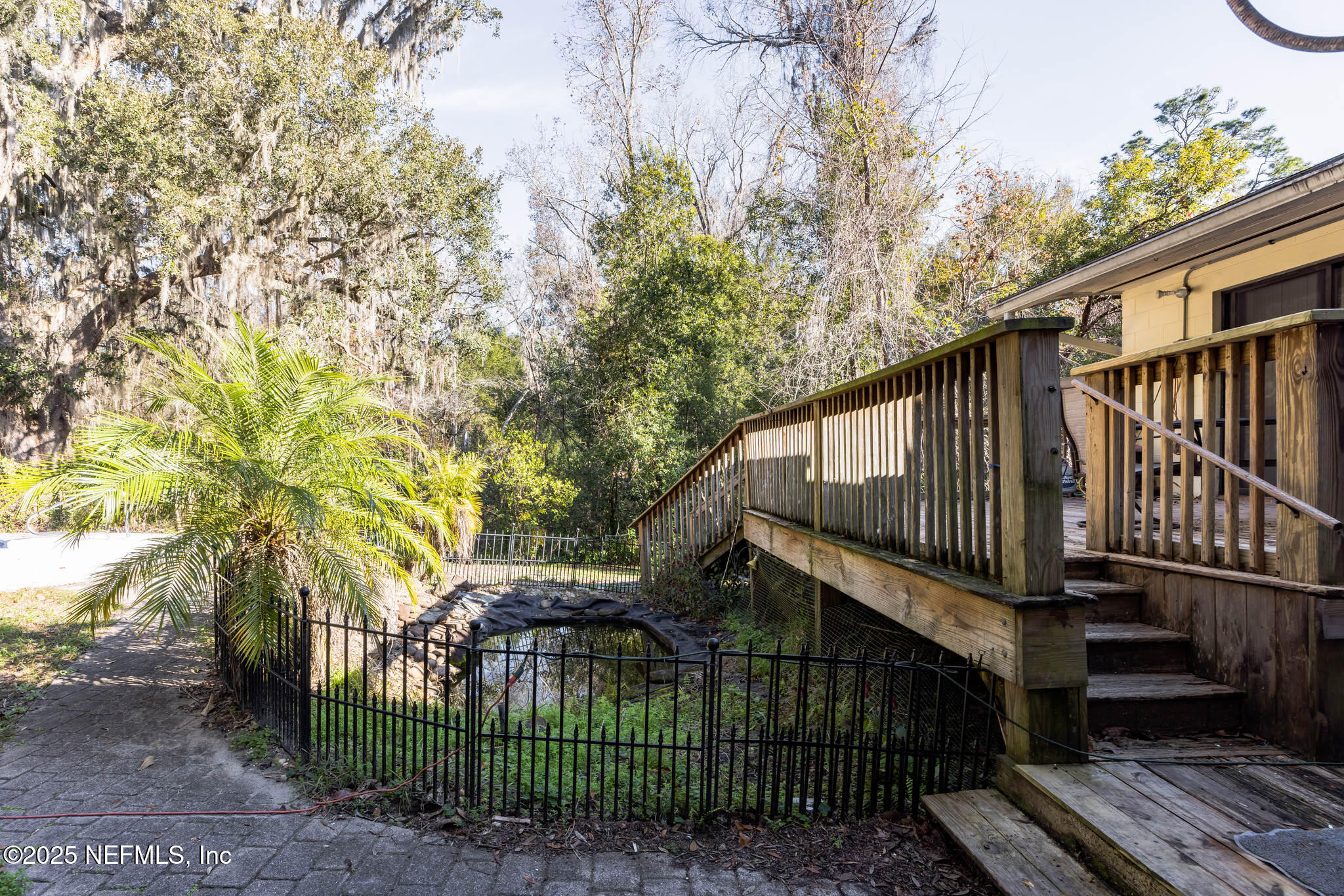 4134 Pine Road Orange Park, FL 32065 - Photo 27 of 30 a view of backyard with deck and garden