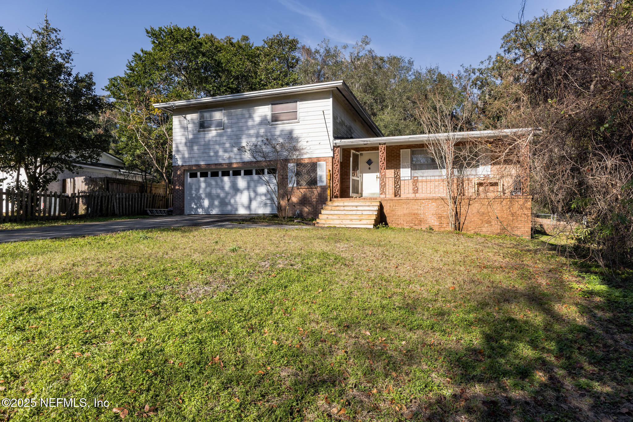 4134 Pine Road Orange Park, FL 32065 - Photo 30 of 30 a view of a house with backyard and trees