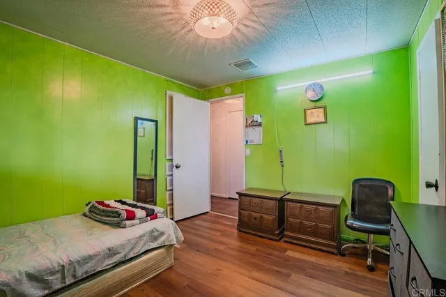 a bedroom with a bed and a bookshelf