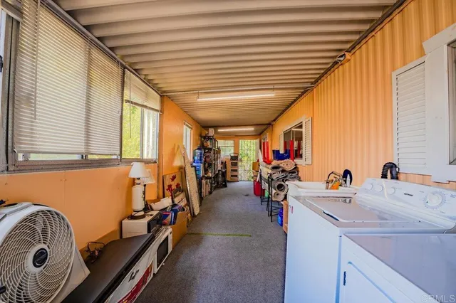 a room with gym equipment and a large window