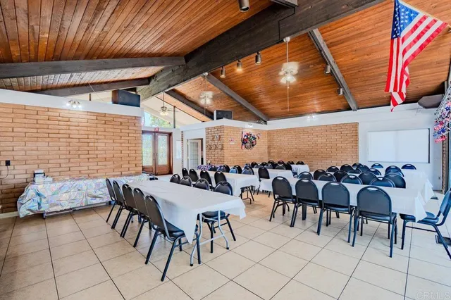 a view of a patio with table and chairs