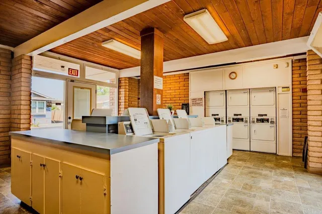 a kitchen with cabinets and white appliances