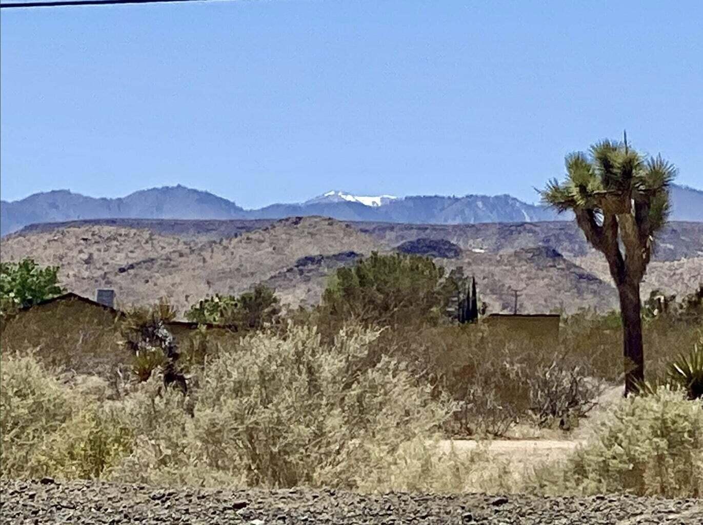 205 Old Woman Springs Road Yucca Valley, CA 92284 - Photo 4 of 33 a view of a lake with a mountain in the background