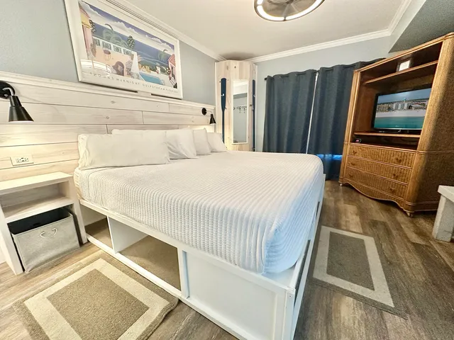 a bedroom with a bed and a dresser