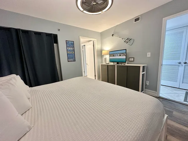 a bedroom with a bed and cabinets