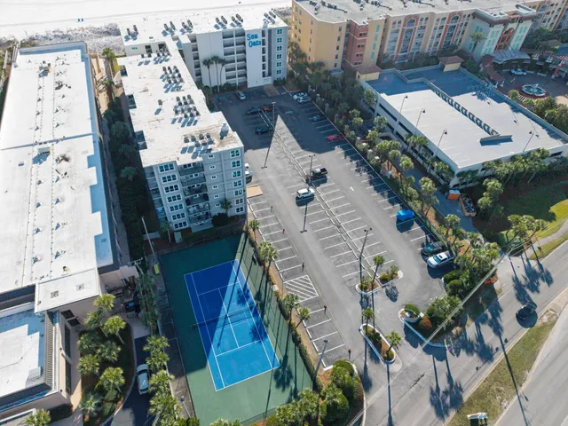 an aerial view of a residential apartment building with yard