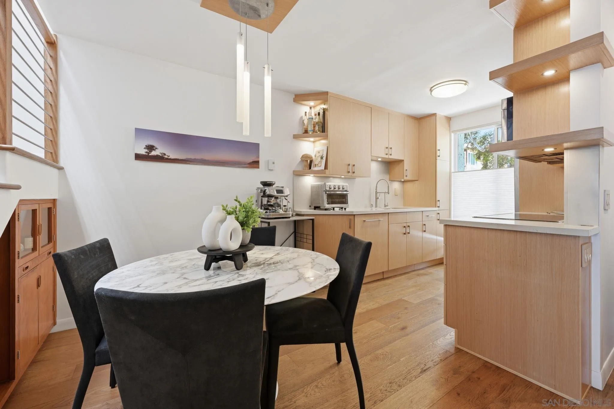 a dining room with furniture and window