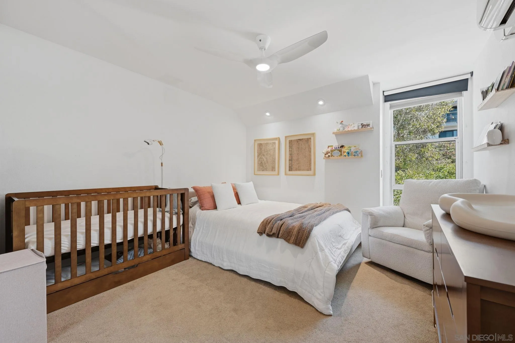 1663 Guy Street San Diego, CA 92103 - Photo 23 of 30 a spacious bedroom with a bed and a couch
