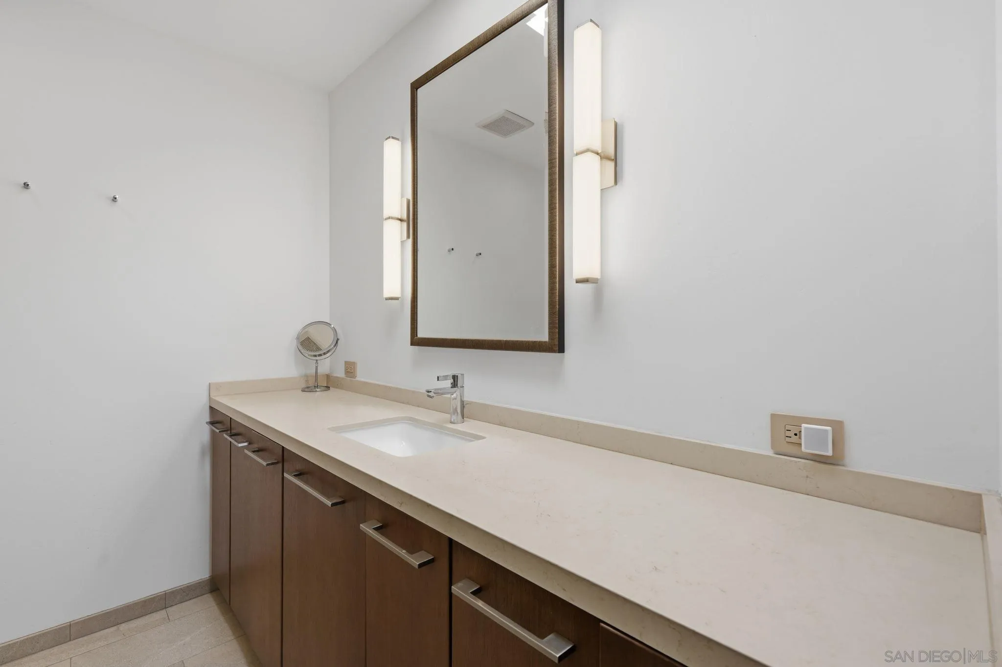 1663 Guy Street San Diego, CA 92103 - Photo 25 of 30 a bathroom with a sink and a mirror