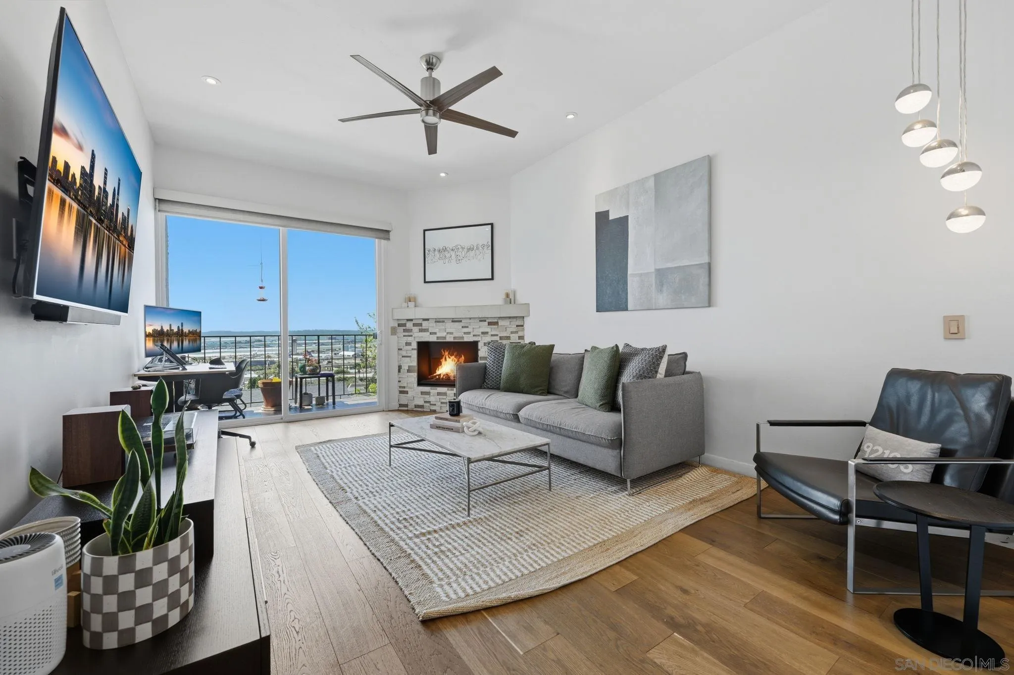 1663 Guy Street San Diego, CA 92103 - Photo 7 of 30 a living room with furniture fireplace and a view of kitchen