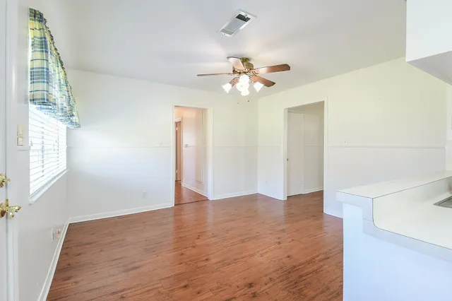 a kitchen with a stove top oven sink and cabinets
