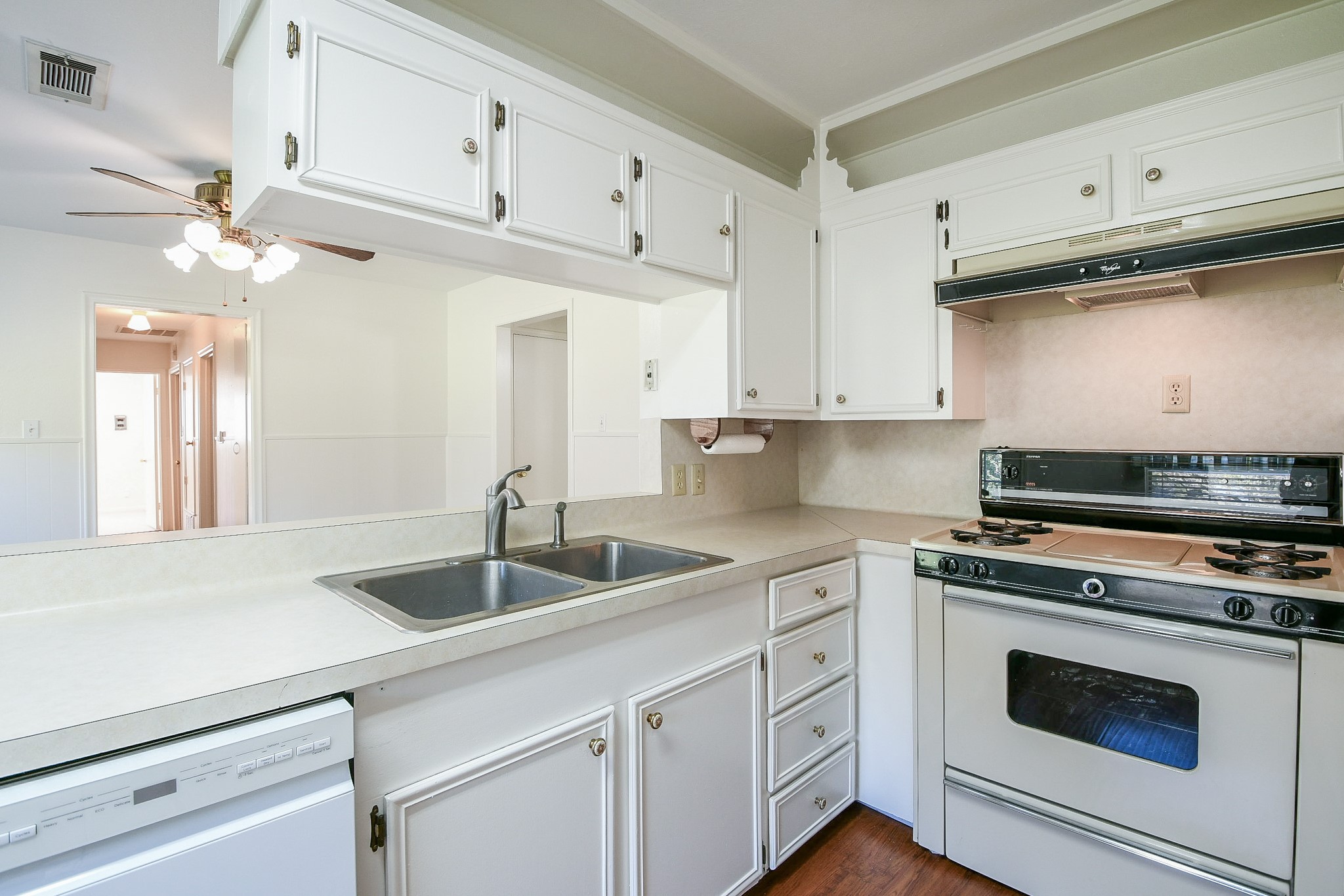 129 Cannon Street Clute, TX 77531 - Photo 13 of 28 a kitchen with stainless steel appliances granite countertop a sink a stove and cabinets