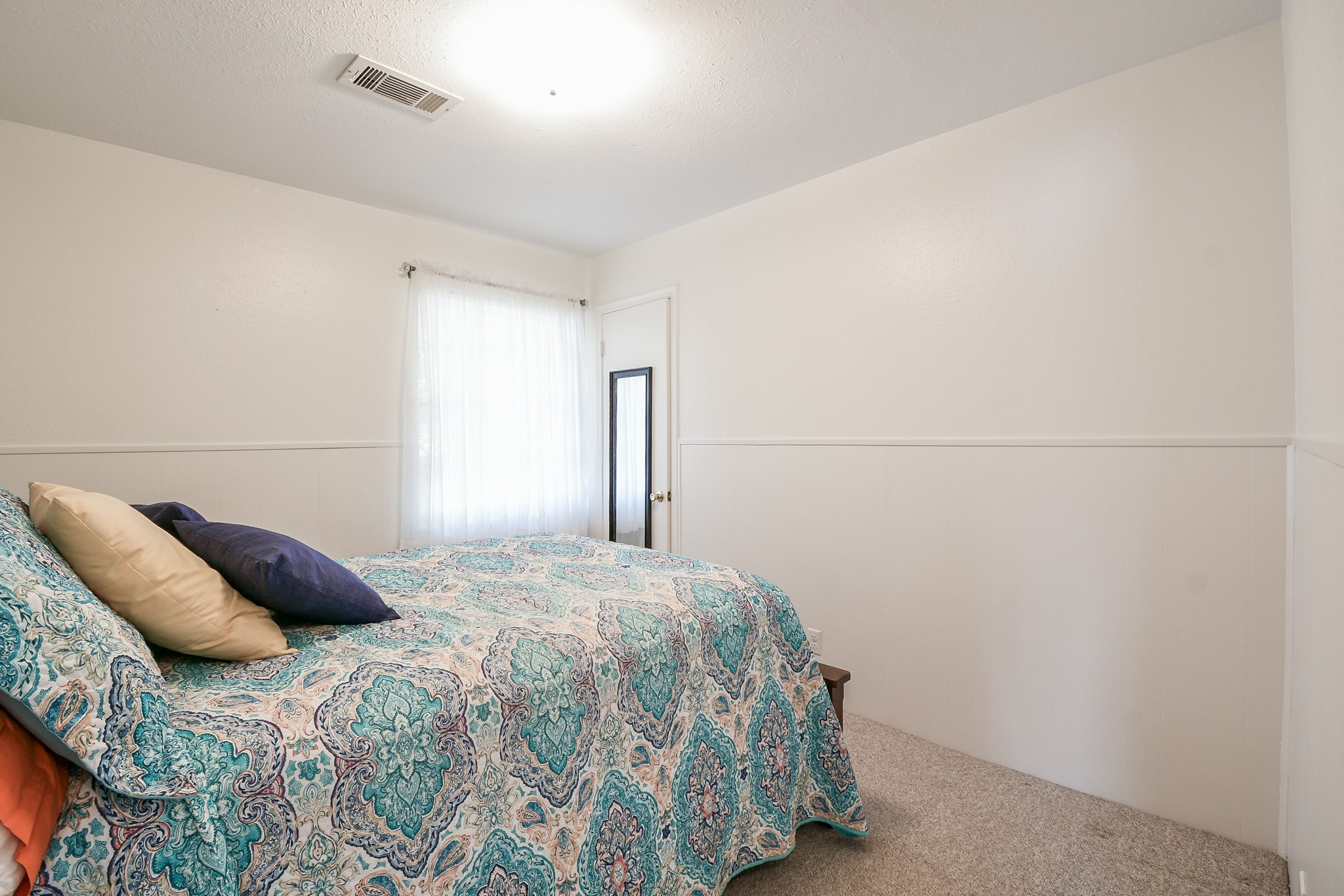 129 Cannon Street Clute, TX 77531 - Photo 20 of 28 a bedroom with a bed and a night stand