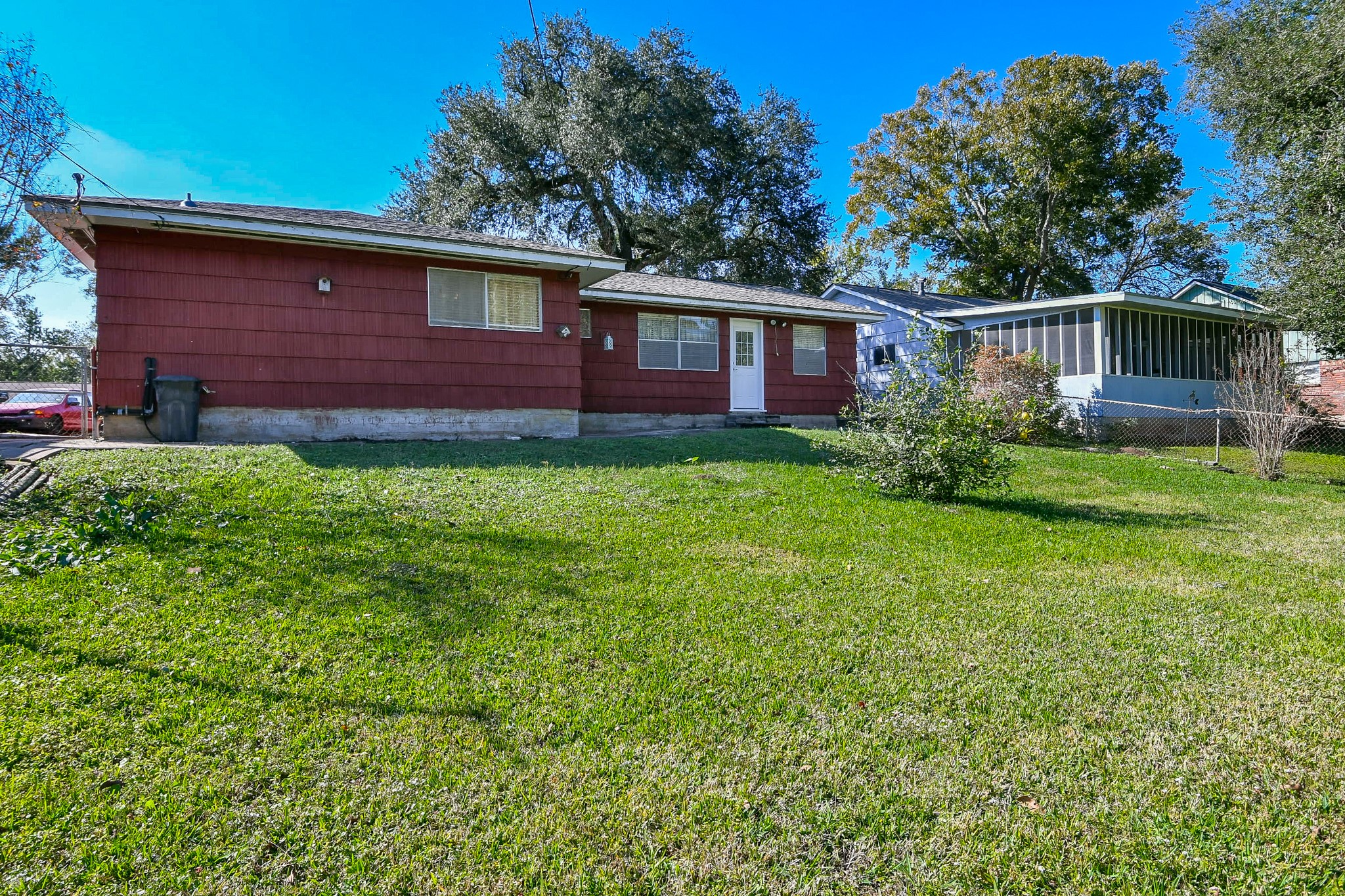 129 Cannon Street Clute, TX 77531 - Photo 25 of 28 a view of a yard in front of a house with large windows