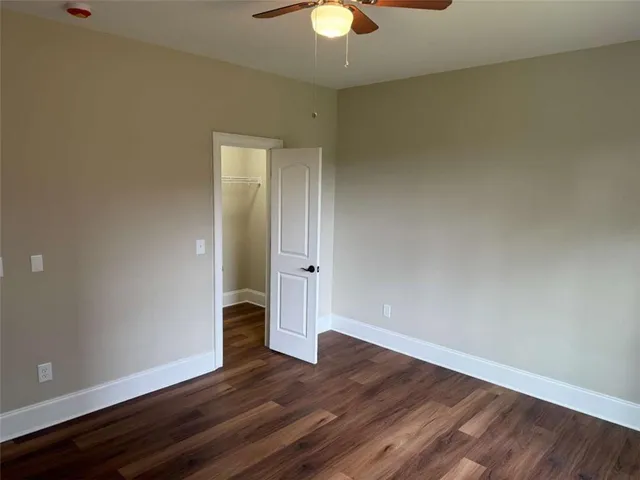 a white toilet sitting next to a bathroom sink