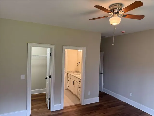 a bathroom with a sink vanity and mirror