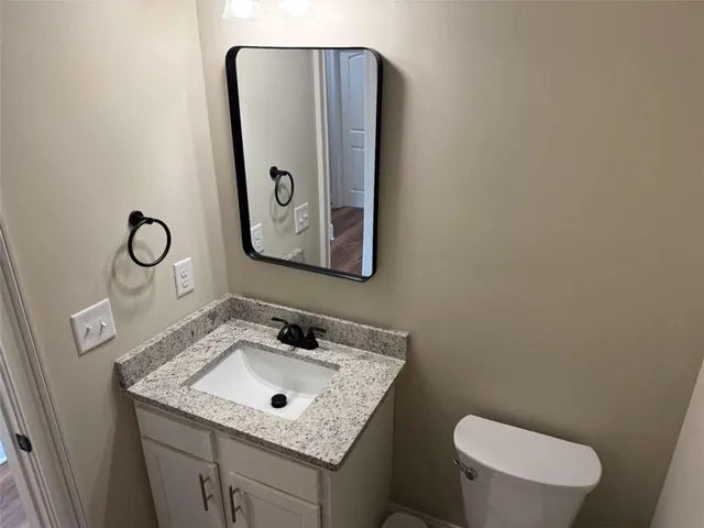 a view of room with wooden floor