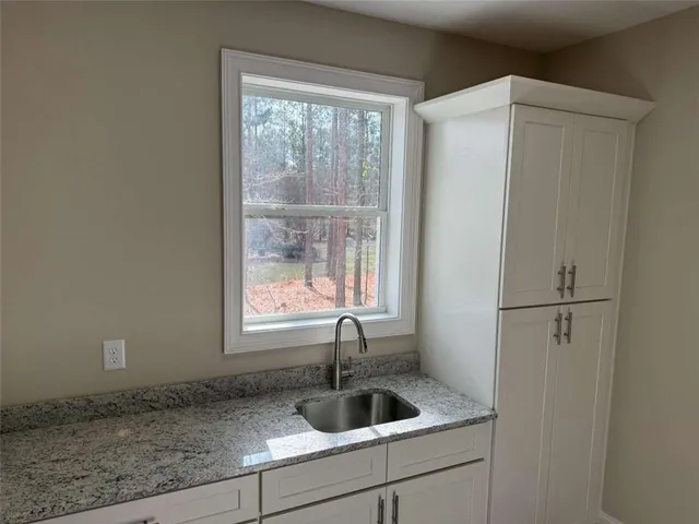 a view of a room with rack on the wall