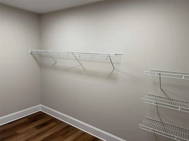 a bathroom with a tub shower and sink