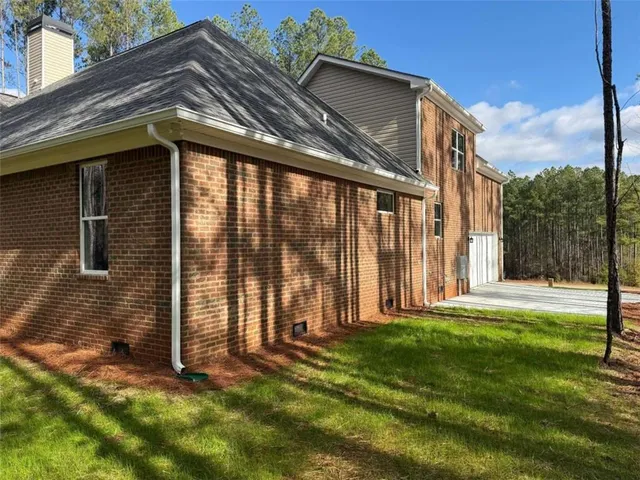 a view of a porch with wooden floor and fence