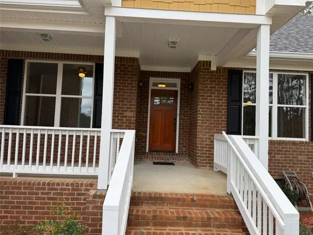 a view of entryway with wooden floor