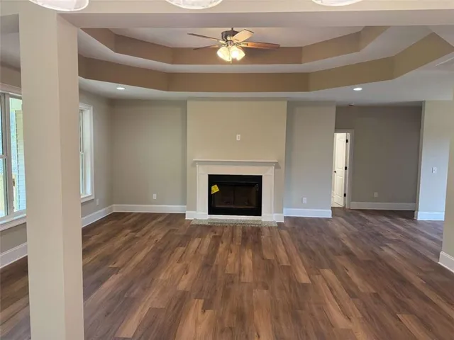 a kitchen with stainless steel appliances granite countertop a sink a stove top oven a counter space and cabinets