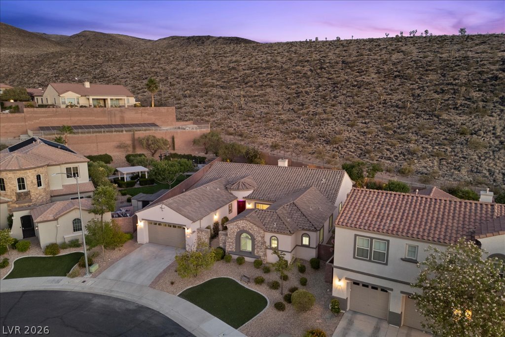 2125 De Rouge Avenue Henderson, NV 89044 - Photo 88 of 96 An aerial perspective reveals the captivating residential enclave nestled against the rugged desert hills.