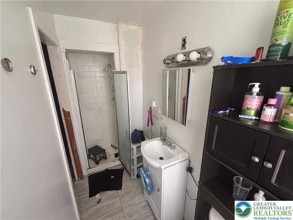 3404 North Ruch Street Whitehall, PA 18052 - Photo 26 of 36 Tiled flooring and a practical shower stall complete this functional bathroom space.