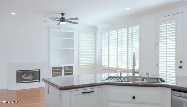 a kitchen with a sink and cabinets
