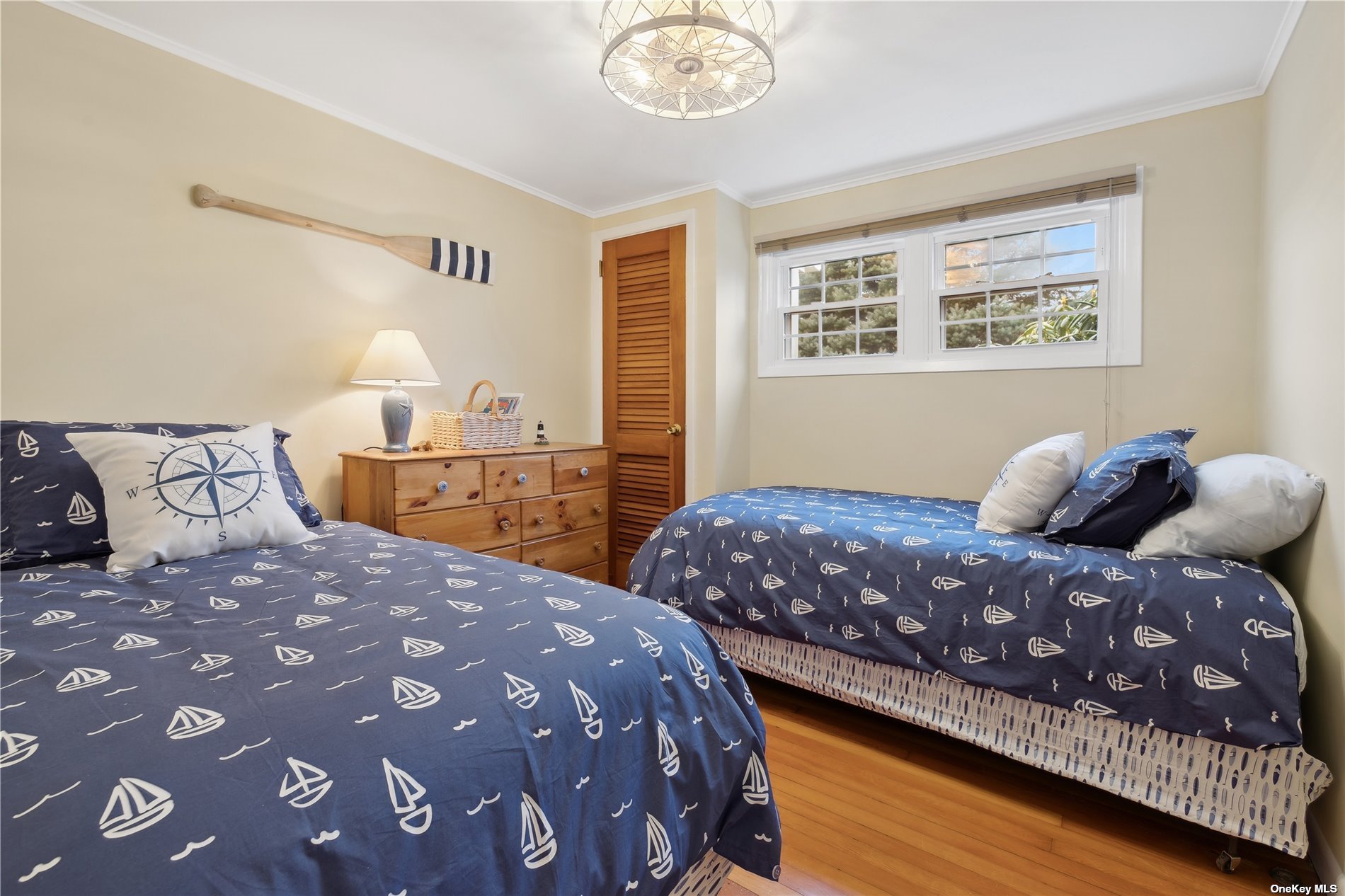 220 Greenport, undefined 00000 - Photo 12 of 21 a bedroom with a large bed and a lamp on dresser