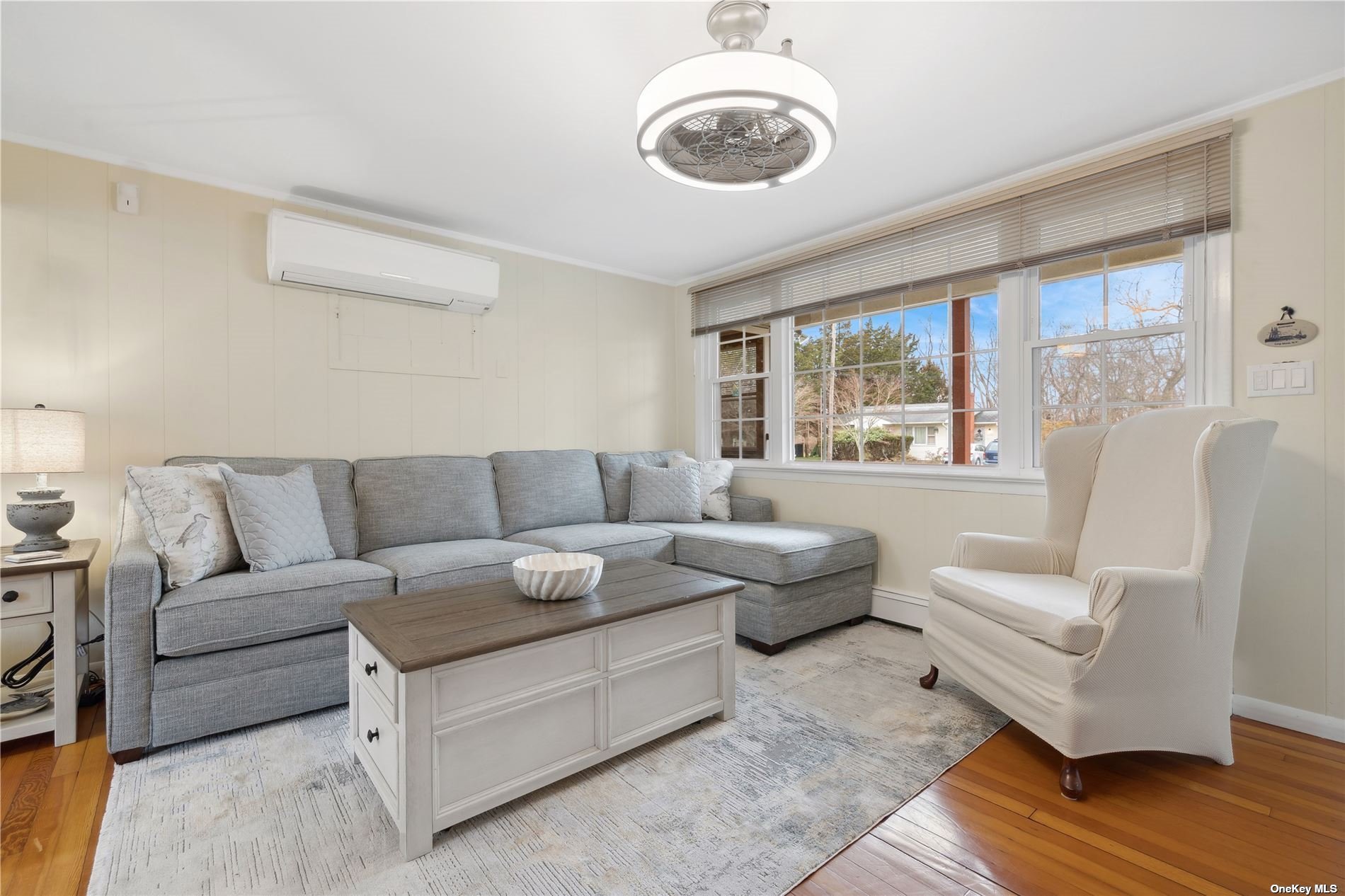 220 Greenport, undefined 00000 - Photo 3 of 21 a living room with furniture ceiling fan and a large window