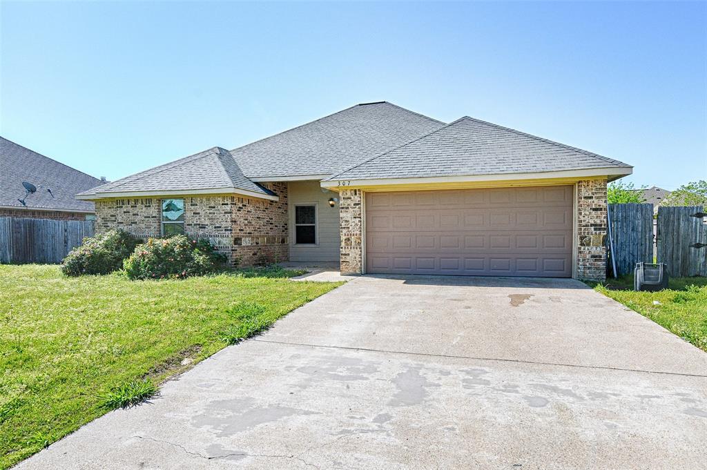 307 Alene Drive Mabank, TX 75147 - Photo 1 of 1 front view of a house with a yard and potted plants