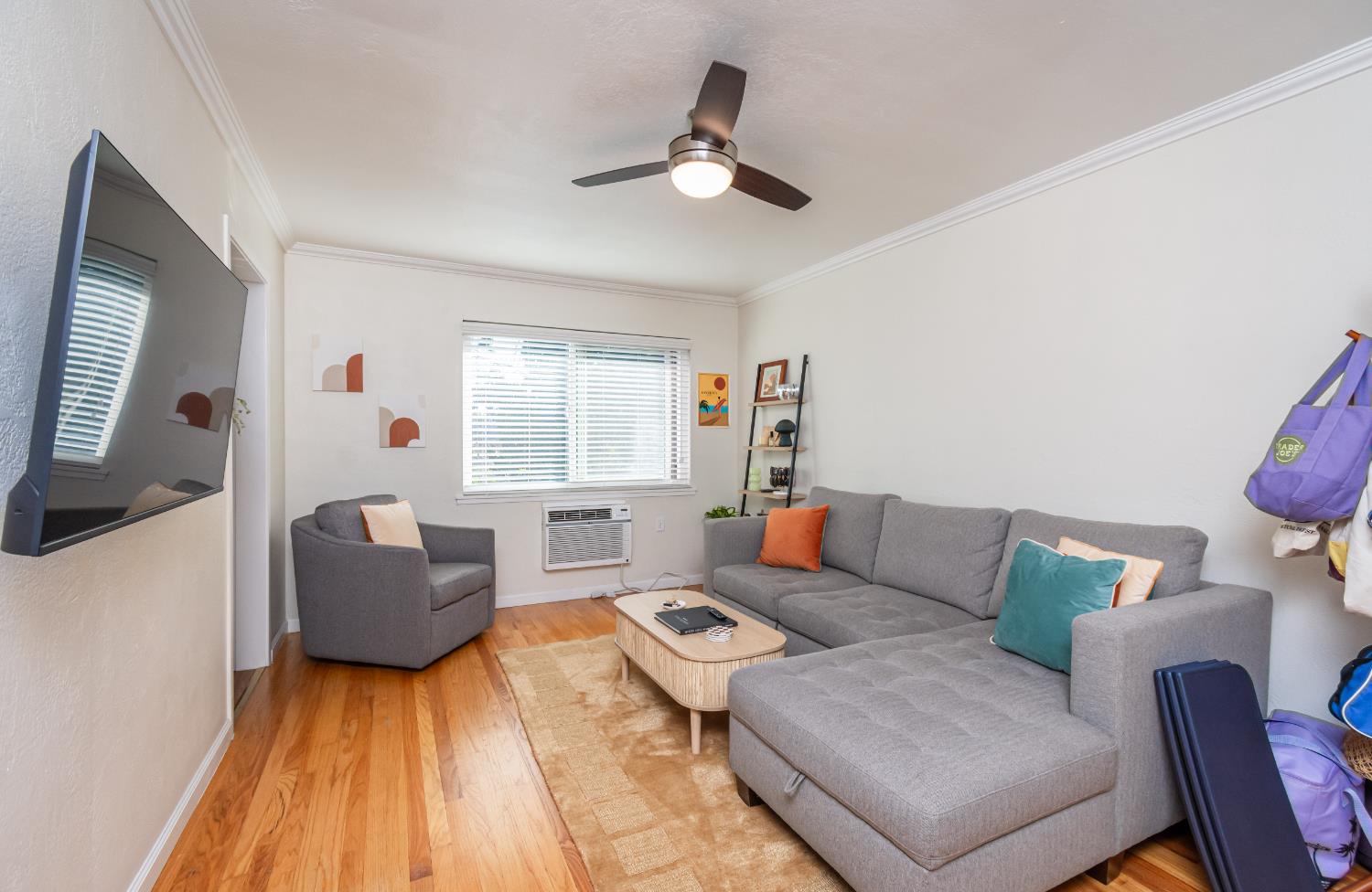2811 F Street Sacramento, CA 95816 - Photo 7 of 22 a living room with furniture and a wooden floor