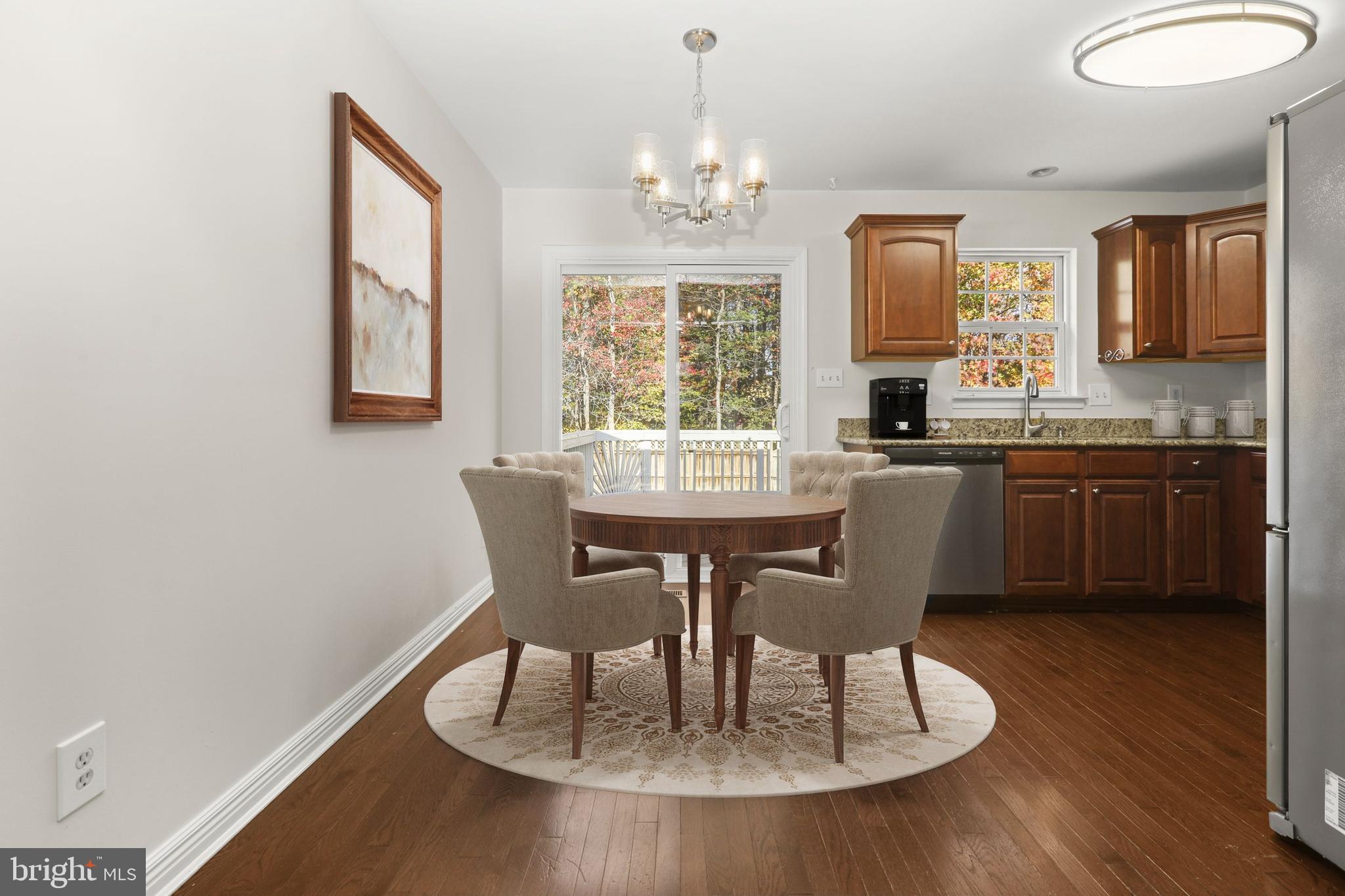 2826 Profitt Path Edgewood, MD 21040 - Photo 11 of 50 a dining room with furniture a chandelier and wooden floor