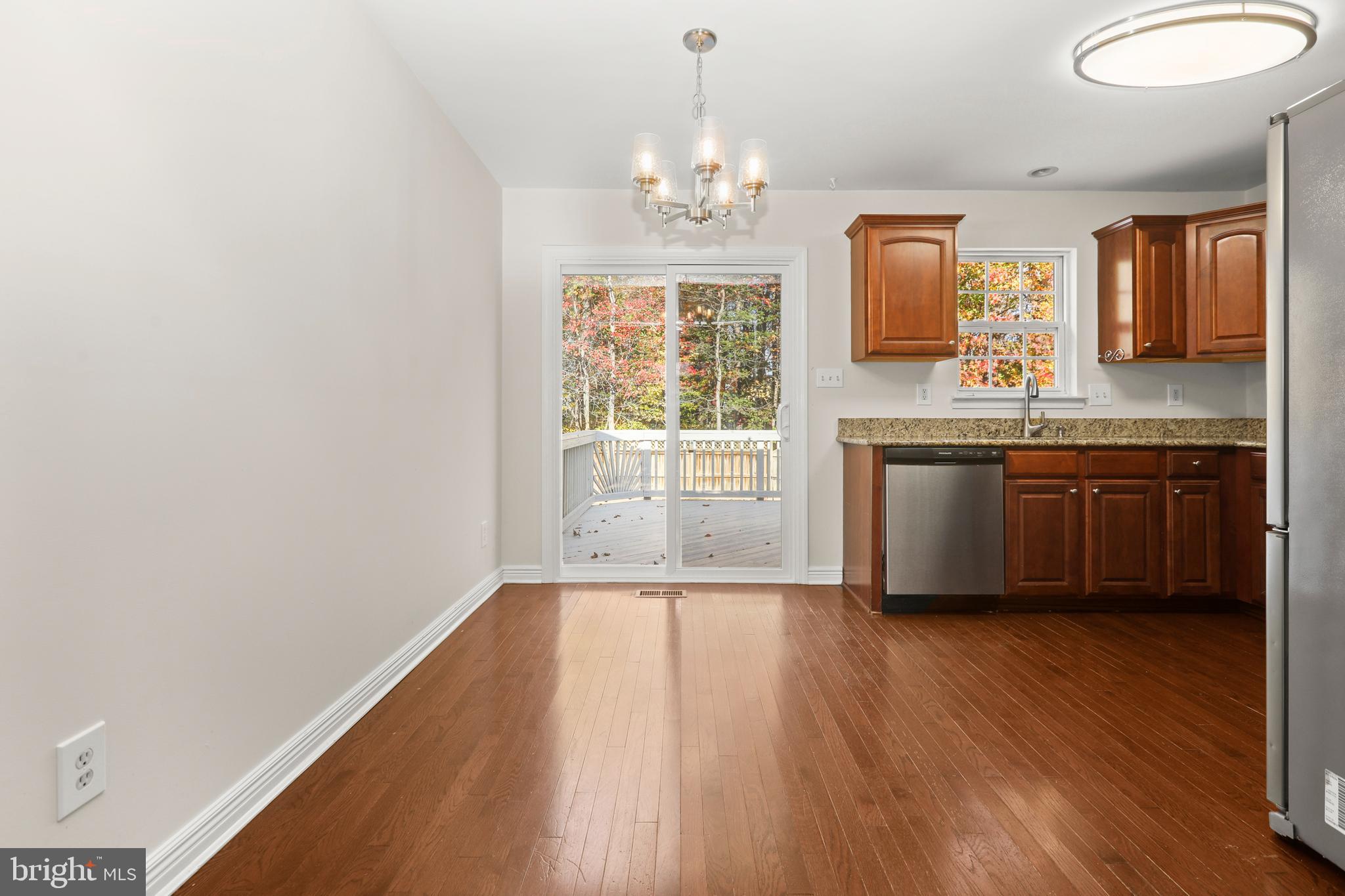 2826 Profitt Path Edgewood, MD 21040 - Photo 12 of 50 a spacious bathroom with a granite countertop sink window and a mirror