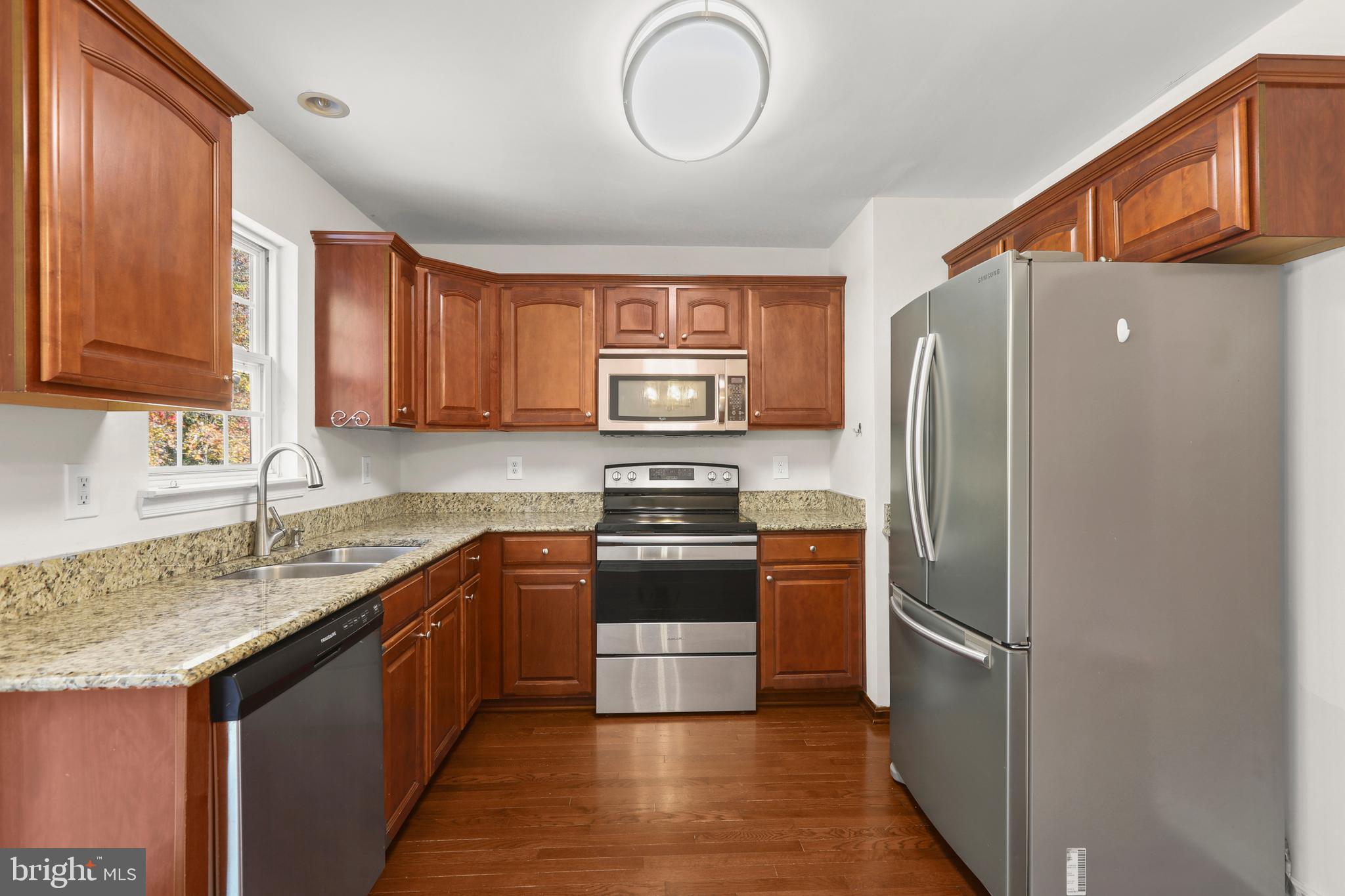 2826 Profitt Path Edgewood, MD 21040 - Photo 13 of 50 a kitchen with stainless steel appliances granite countertop a refrigerator and a sink