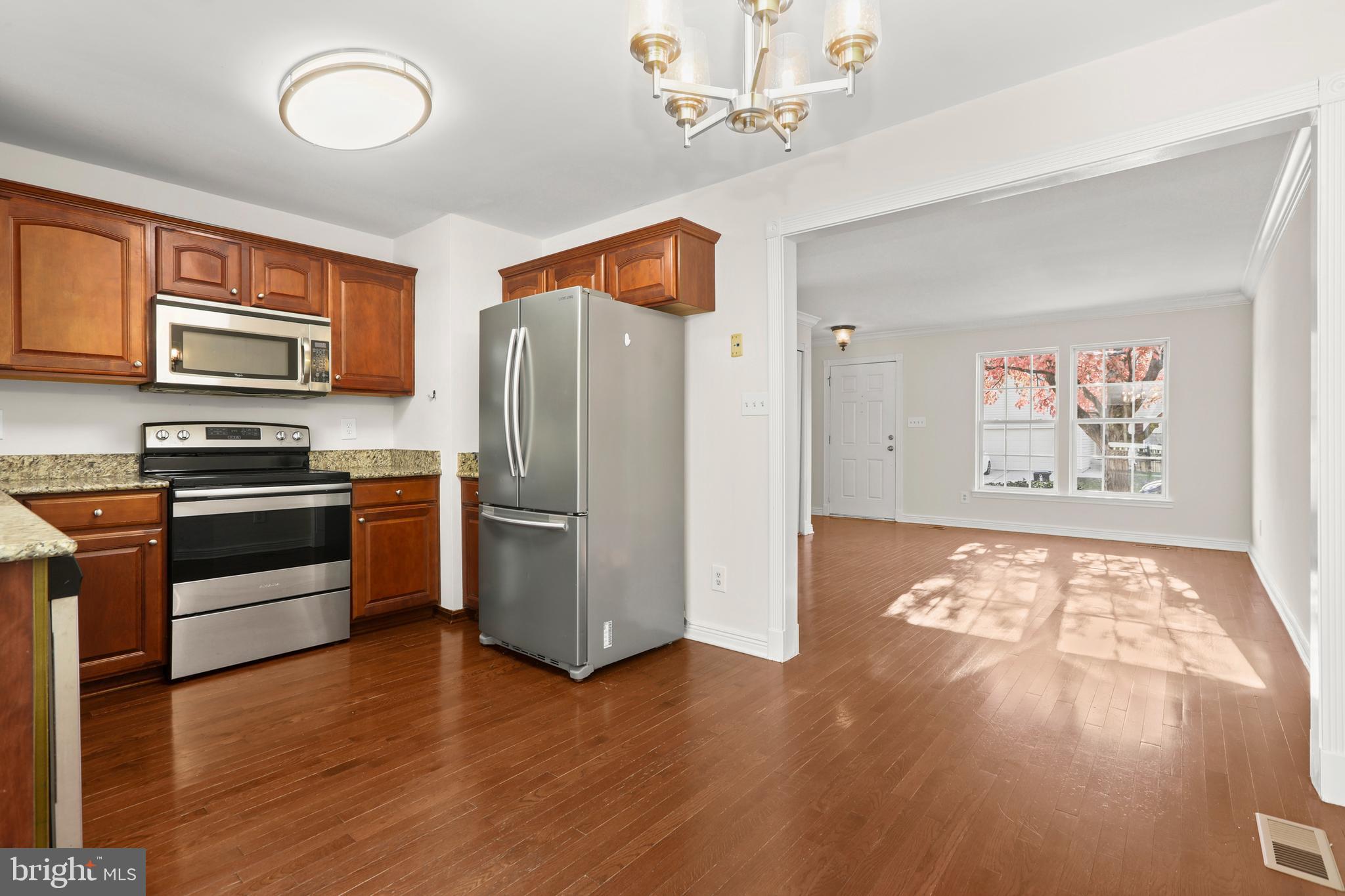 2826 Profitt Path Edgewood, MD 21040 - Photo 14 of 50 a kitchen with stainless steel appliances a refrigerator and a stove top oven