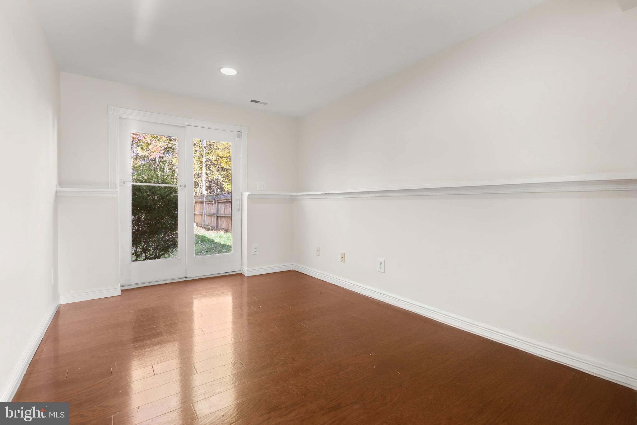2826 Profitt Path Edgewood, MD 21040 - Photo 34 of 50 an empty room with wooden floor and windows