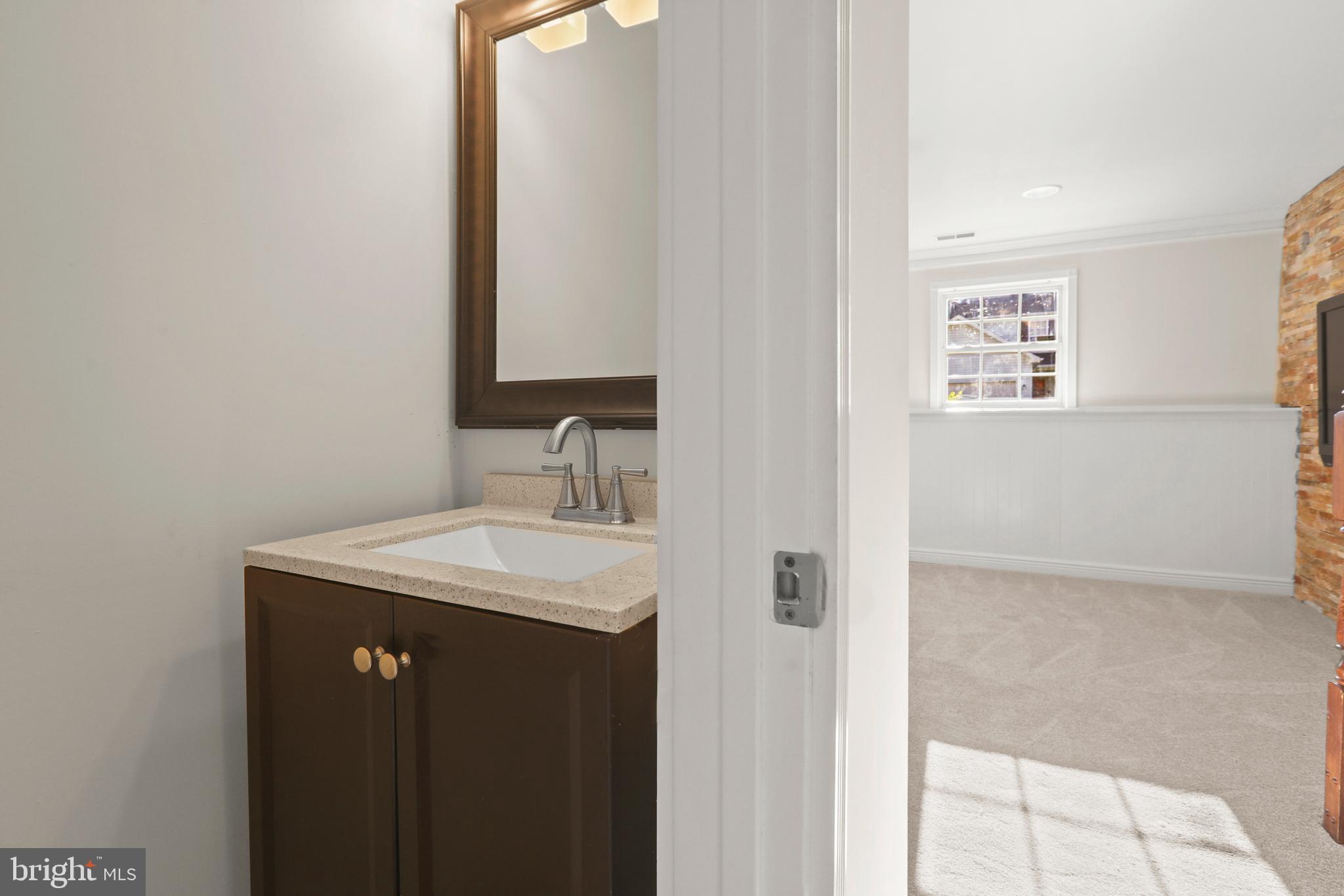 2826 Profitt Path Edgewood, MD 21040 - Photo 35 of 50 a bathroom with a sink a mirror and vanity